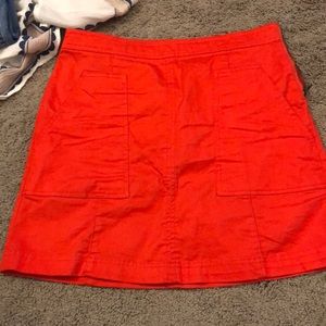 orangey/red skirt w pockets